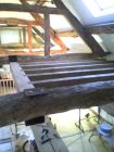 Oak beams forming a mezzanine floor.